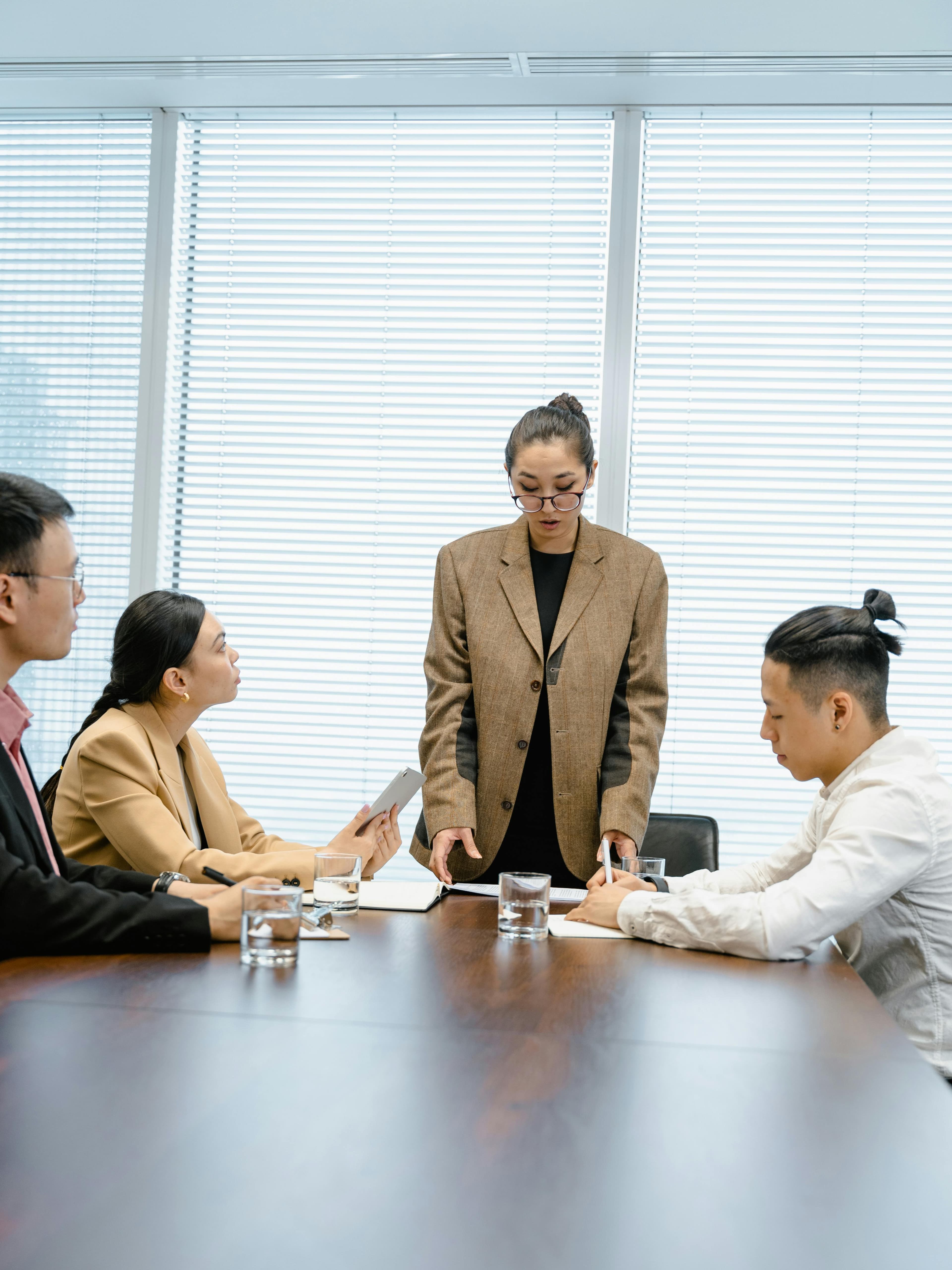 Agency team reviewing reports together in a meeting.